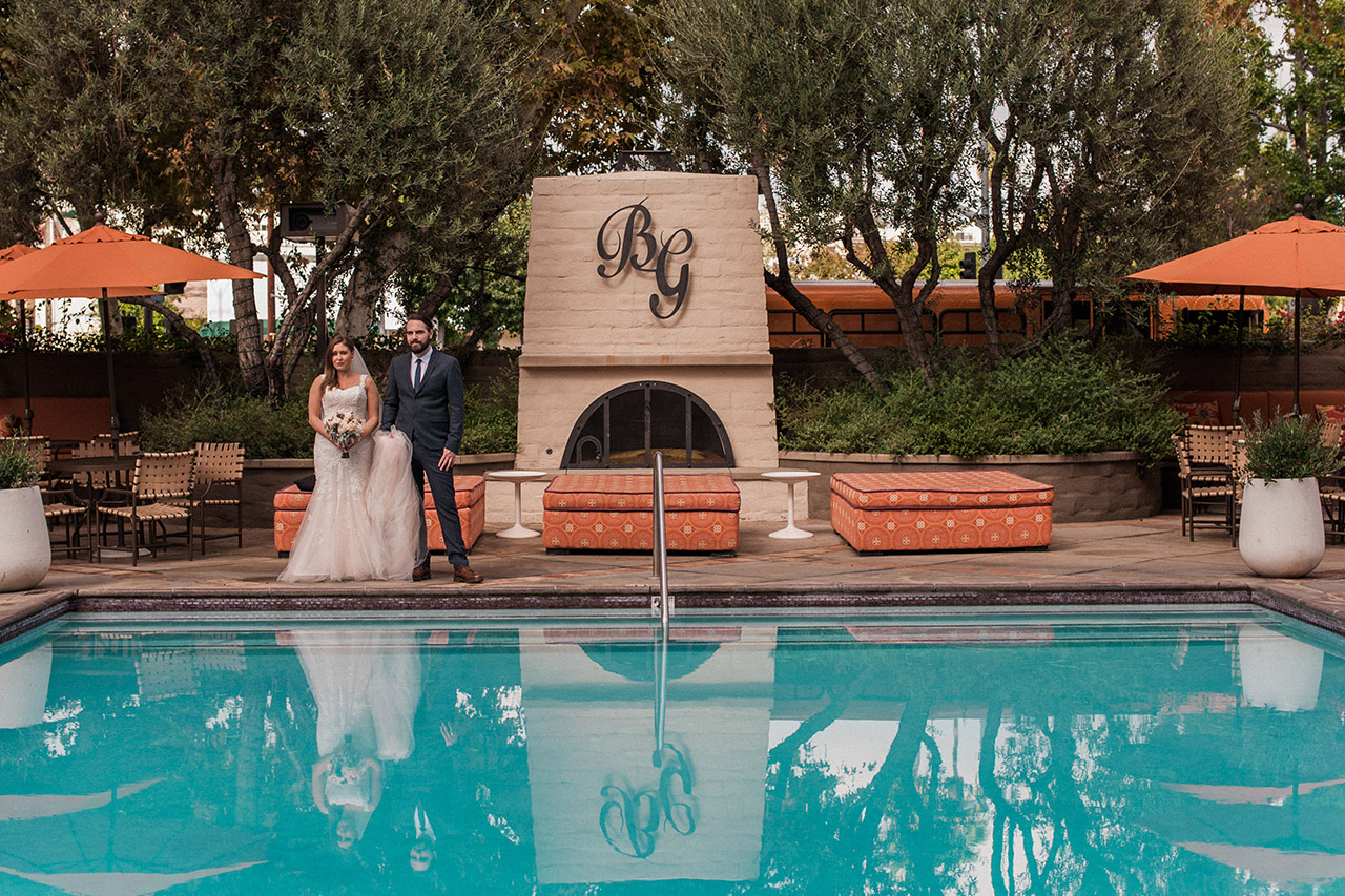 A view of the pool and fireplace