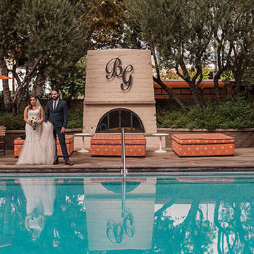 A view of the pool and fireplace