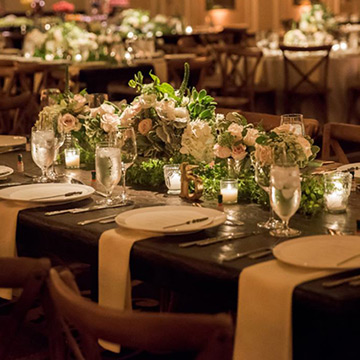 An indoor wedding reception dinner setup