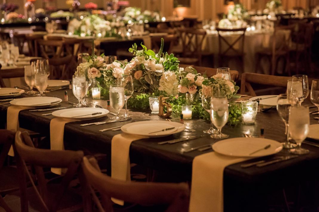 An indoor wedding reception dinner setup